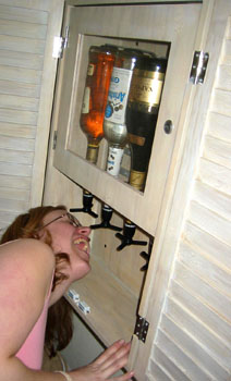 [ Emma at the room's bar ]