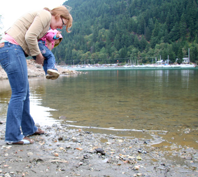 [ Emma helps Morgan throw stones ]