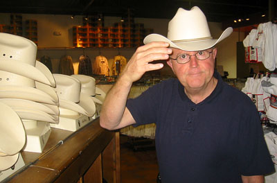 [ Jim tries a hat ]