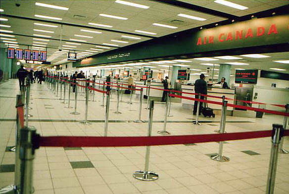 [ Empty check-in counter for Air Canada. ]