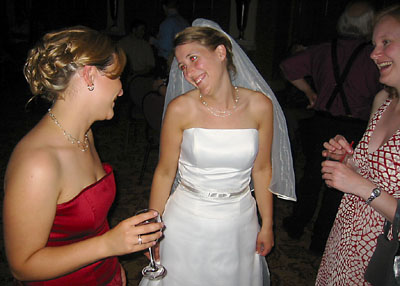 [ Emma shares a laugh with MT and her sister ]