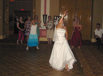 [ The bride throws the bouquet ]