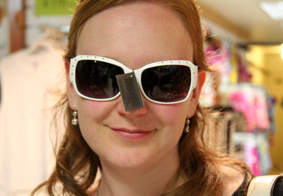 [ Emma tries on sunglasses ]