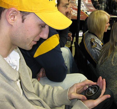 [ James and a game puck ]