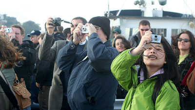 [ Tourists taking pictures ]