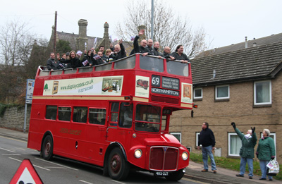 [ The team rides back on the buses ]